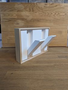Hidden coat pegs